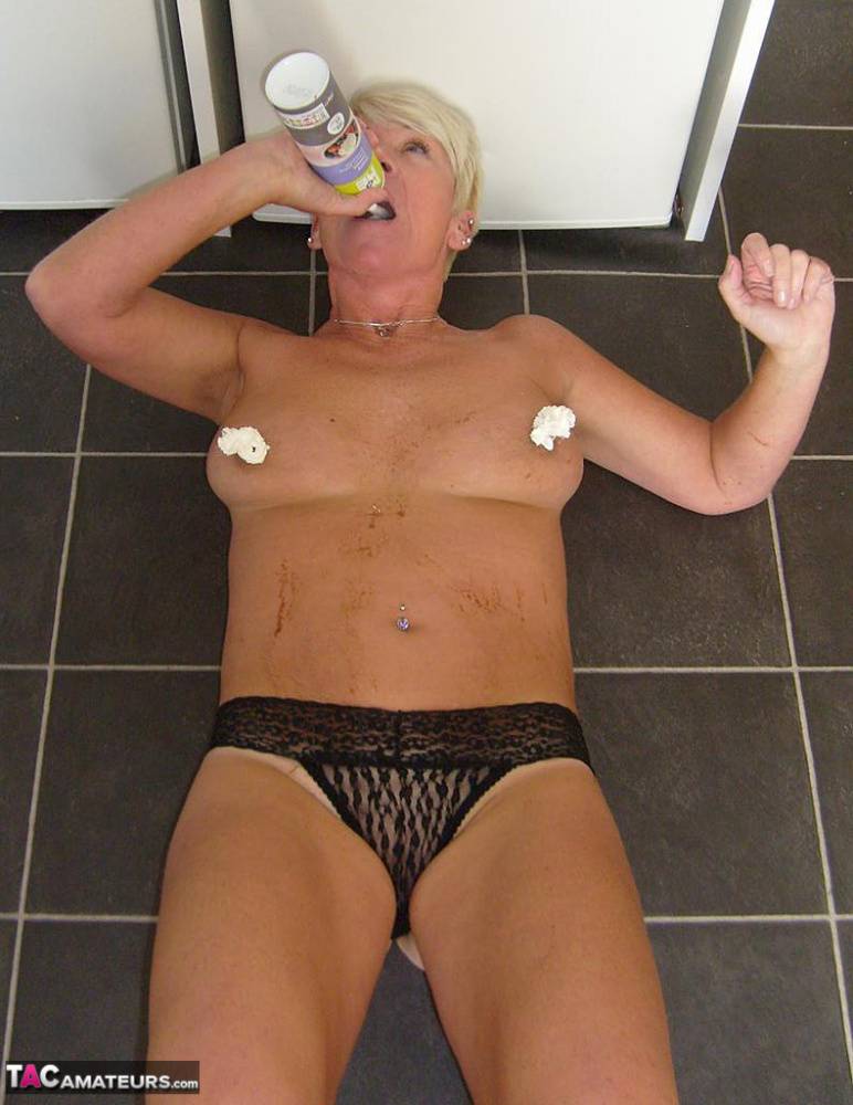 Older woman with short blonde hair Shazzy B covers her tits & twat in cream - #6