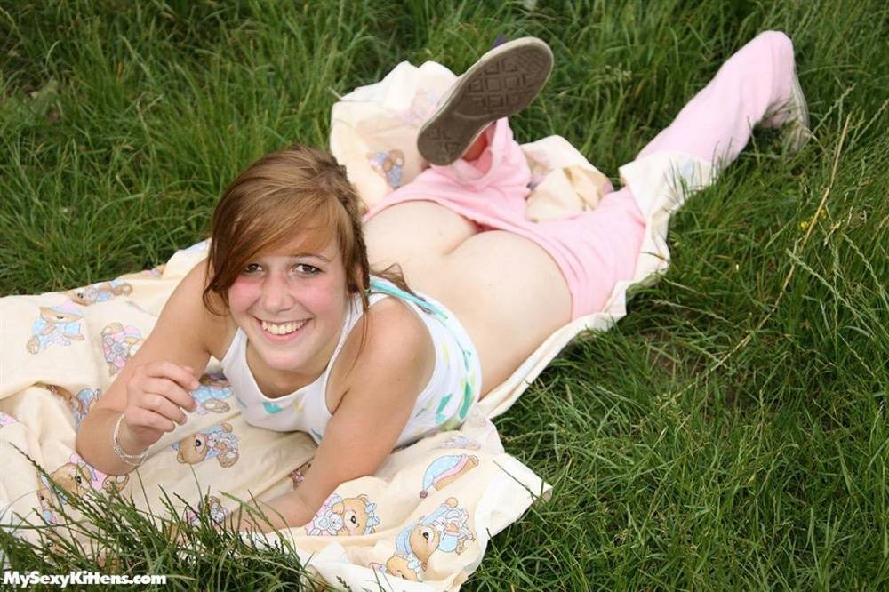 Teen amateur disrobes before fingering her pussy on a blanket out in the yard - #3