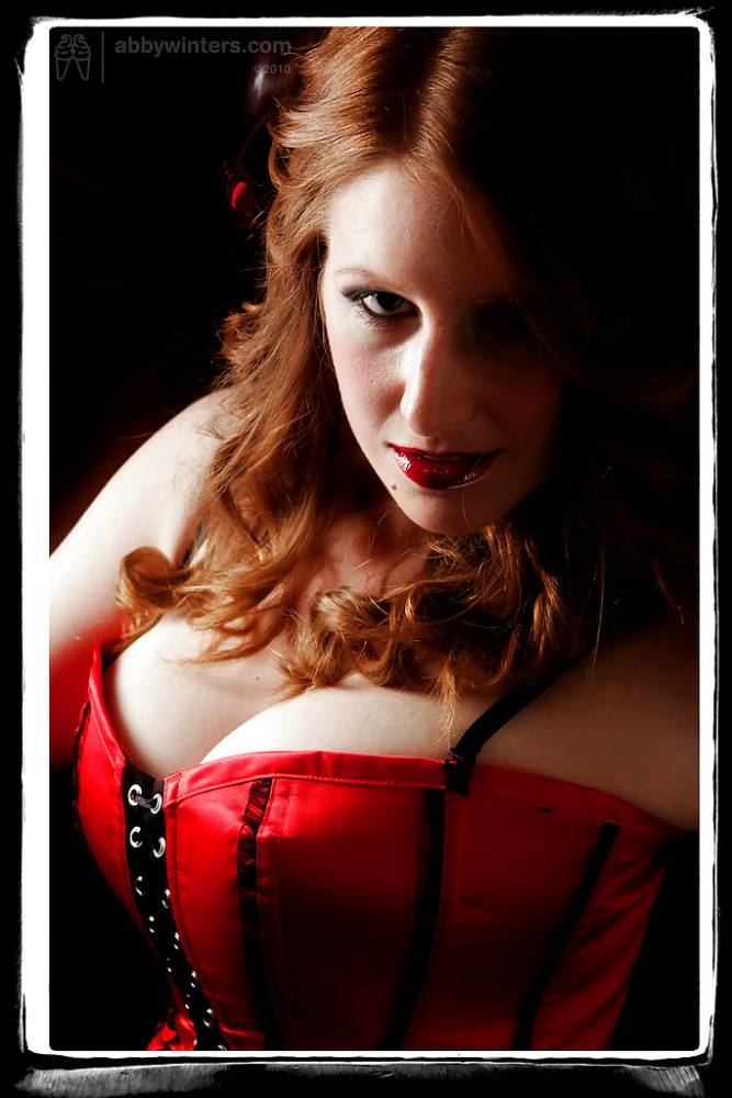 Busty redhead Chloe B assuming sexy solo poses in red corset and lingerie - #6