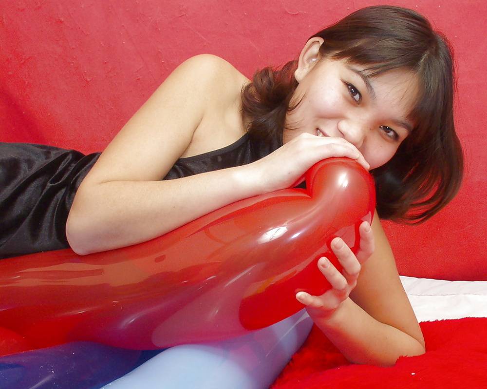 Naughty thai girl in sexy dress playing with a big red balloon - #9