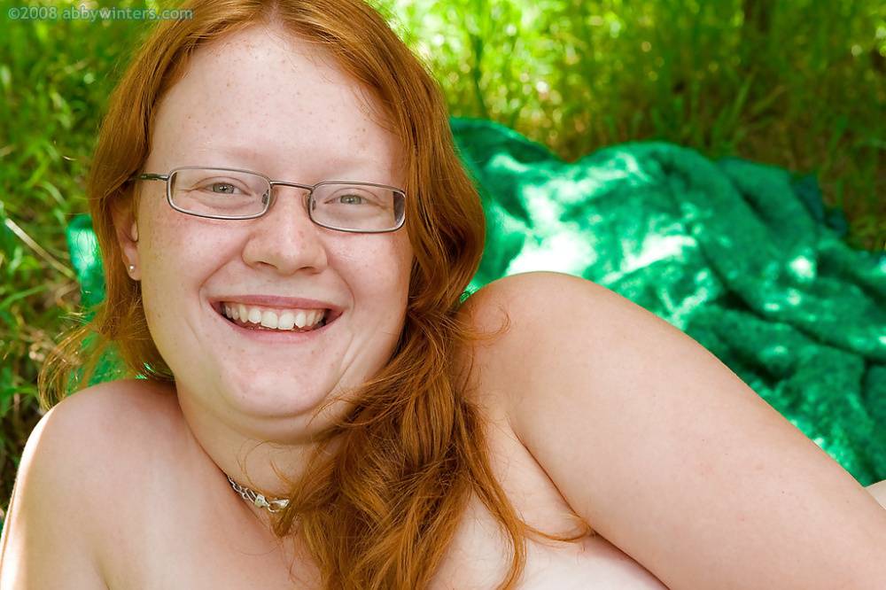 Ugly redhead chick in glasses strips naked outdoors for pussy spreading - #11