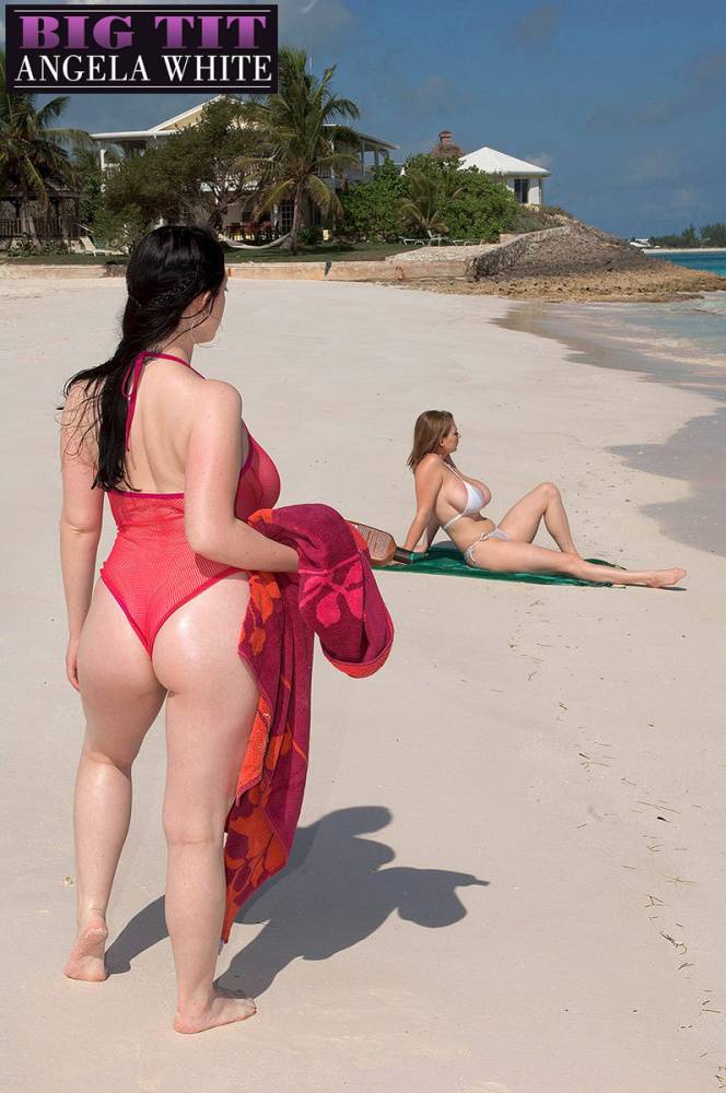 Busty lesbian girls let their huge knockers loose to kiss & lick on the beach - #15