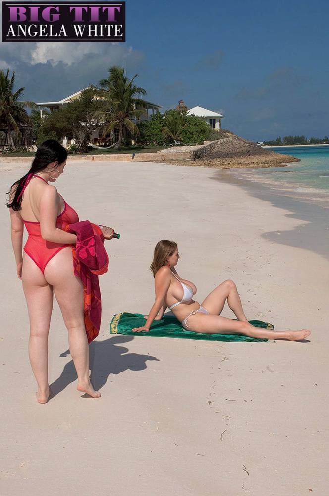 Busty lesbian girls let their huge knockers loose to kiss & lick on the beach - #13