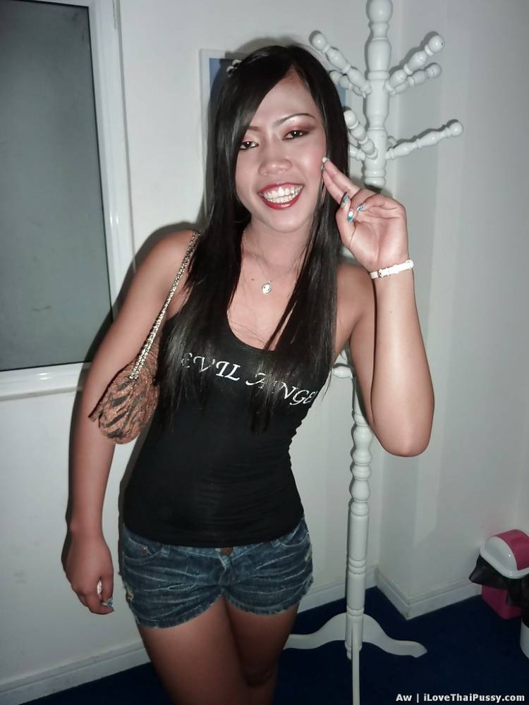 Seductive asian babe with slender legs posing in jeans shorts and black top - #11