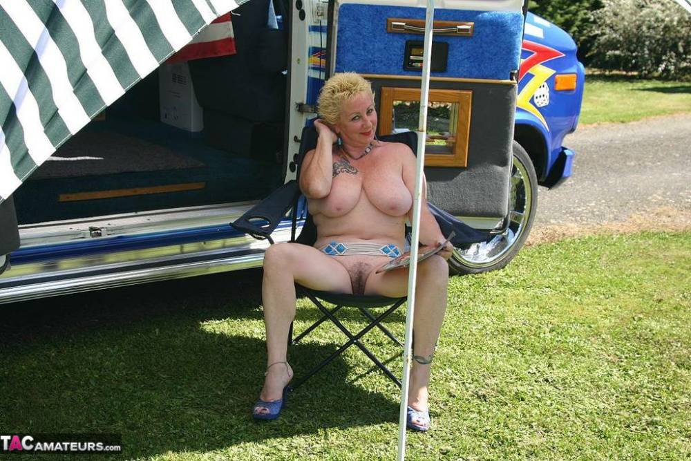 Mature blonde Mary Bitch shows her big tits and pussy outside a B class camper - #16
