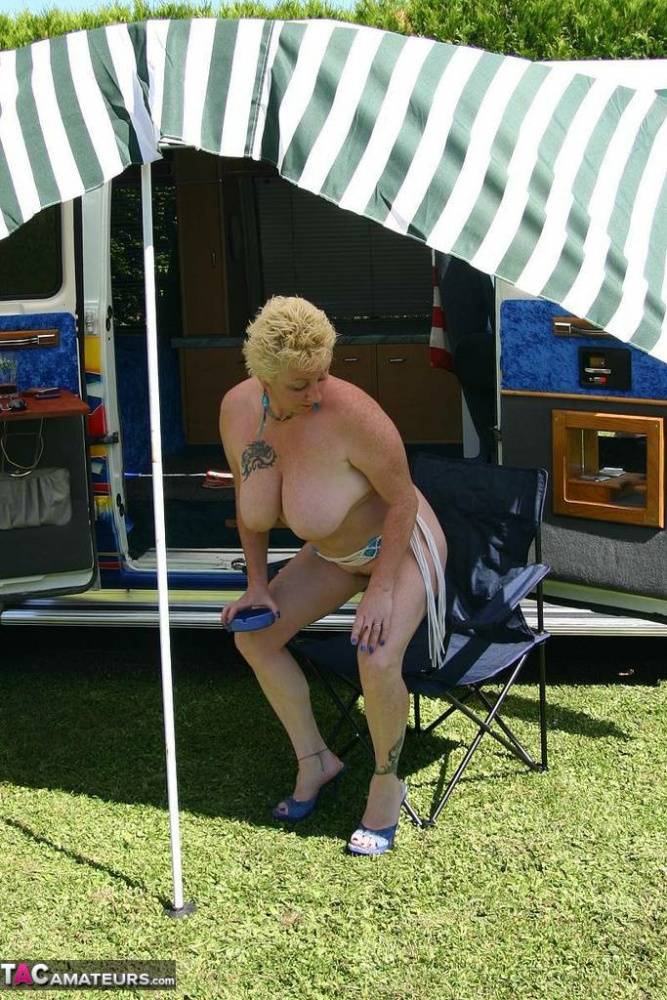 Mature blonde Mary Bitch shows her big tits and pussy outside a B class camper - #4