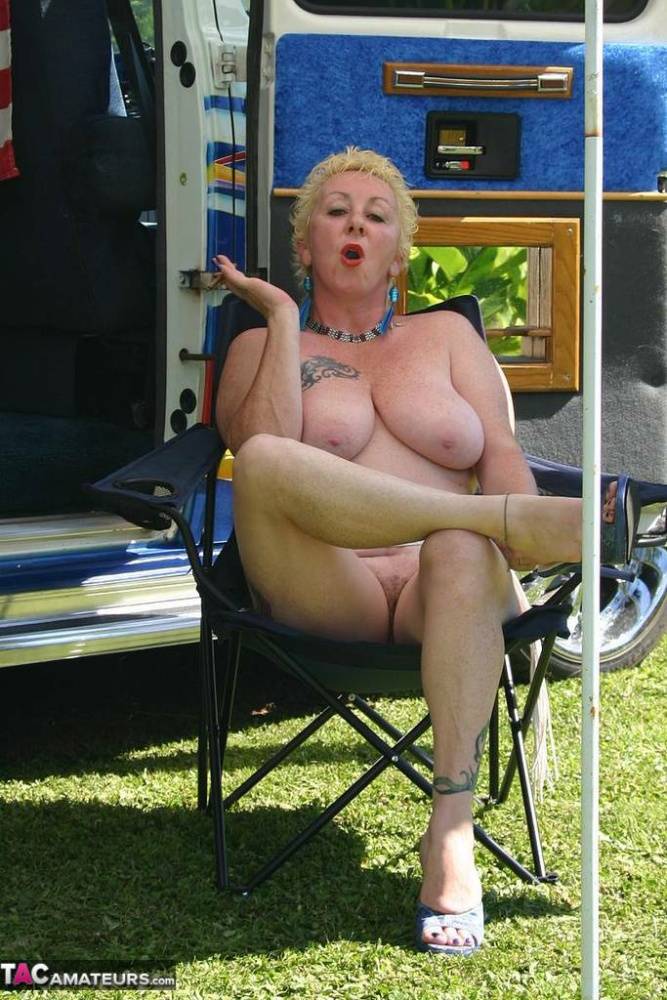 Mature blonde Mary Bitch shows her big tits and pussy outside a B class camper - #12