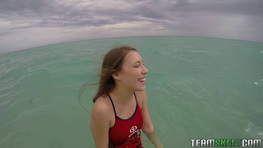 Teen babe Kimber Lee flashing large natural tits in the ocean - #14