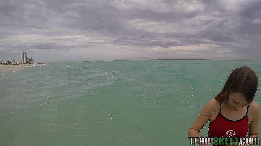 Teen babe Kimber Lee flashing large natural tits in the ocean - #4