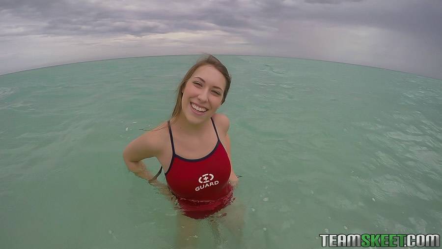 Teen babe Kimber Lee flashing large natural tits in the ocean - #8