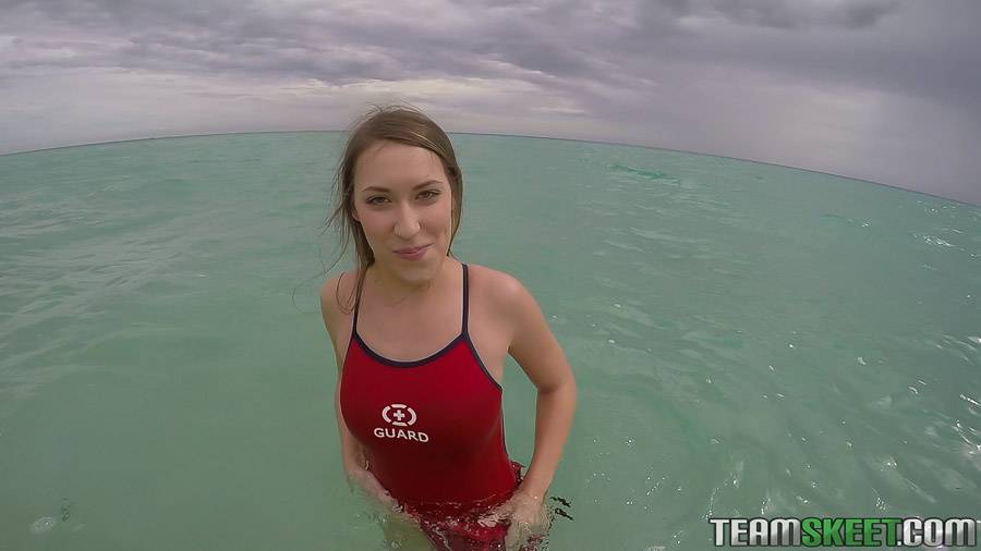 Teen babe Kimber Lee flashing large natural tits in the ocean - #9