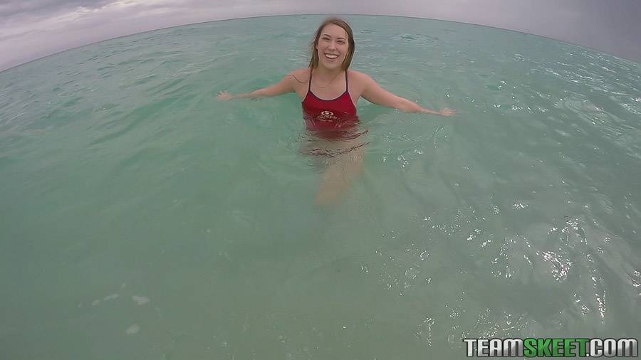 Teen babe Kimber Lee flashing large natural tits in the ocean - #5