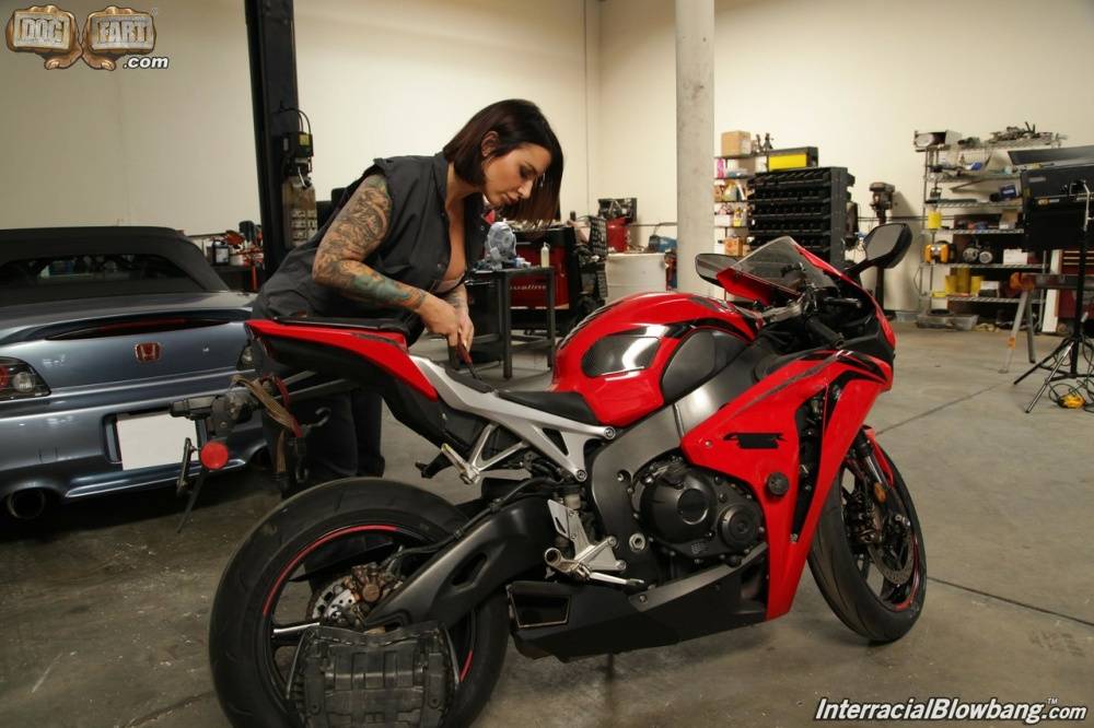 Tattooed chick sheds mechanic attire before an interracial blowbang - #15