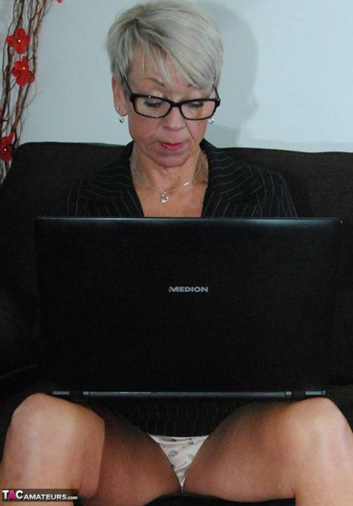 Mature lady Shazzy B sports short hair while exposing her upskirt underwear - #4