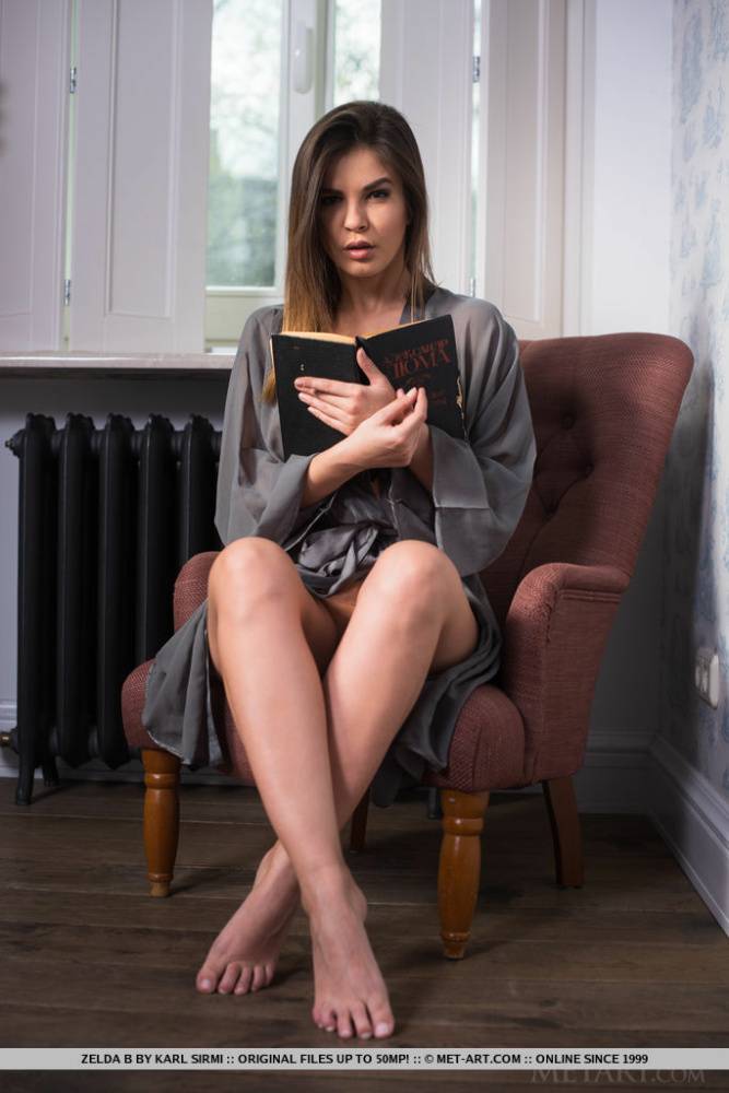 Beautiful young girl Zelda B gets totally naked while reading a book - #2