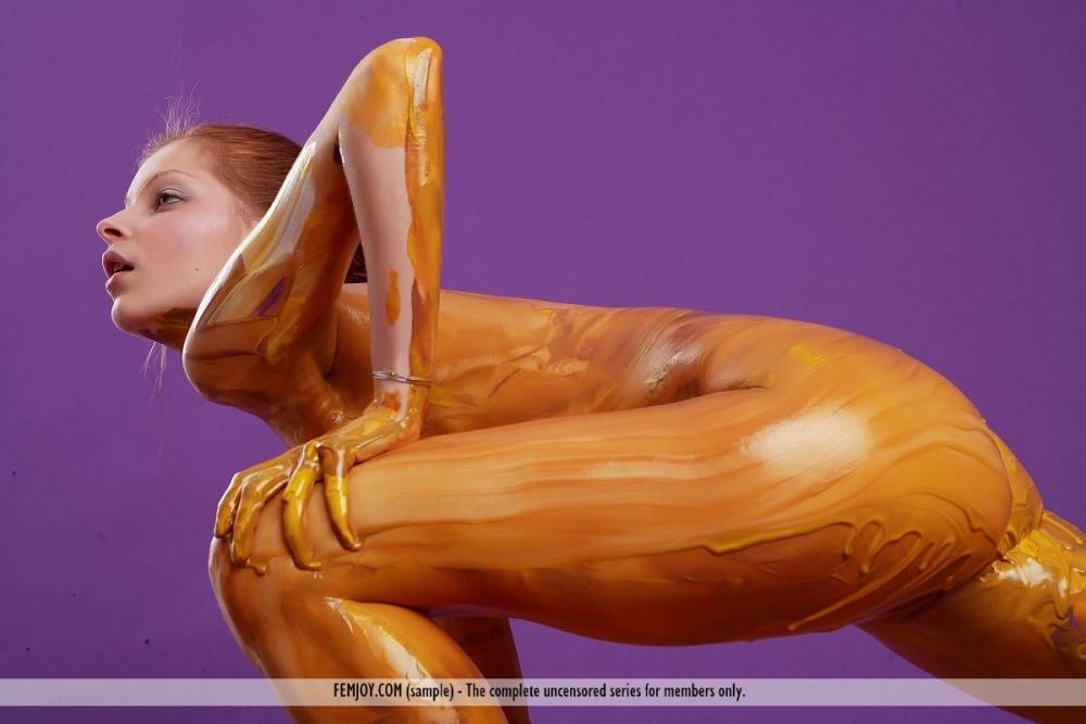 Slender redhead Angelina B covers her totally naked body with body paint - #2