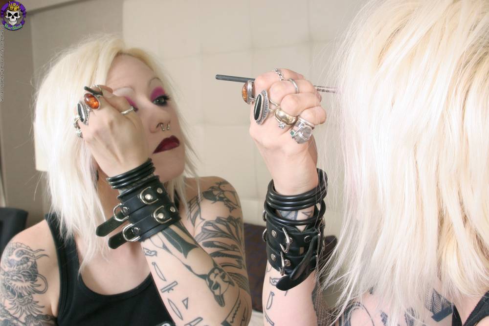 Tattooed blonde rocker Cindy B does her makeup while wearing a strapon cock - #5