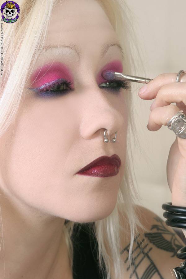 Tattooed blonde rocker Cindy B does her makeup while wearing a strapon cock - #11