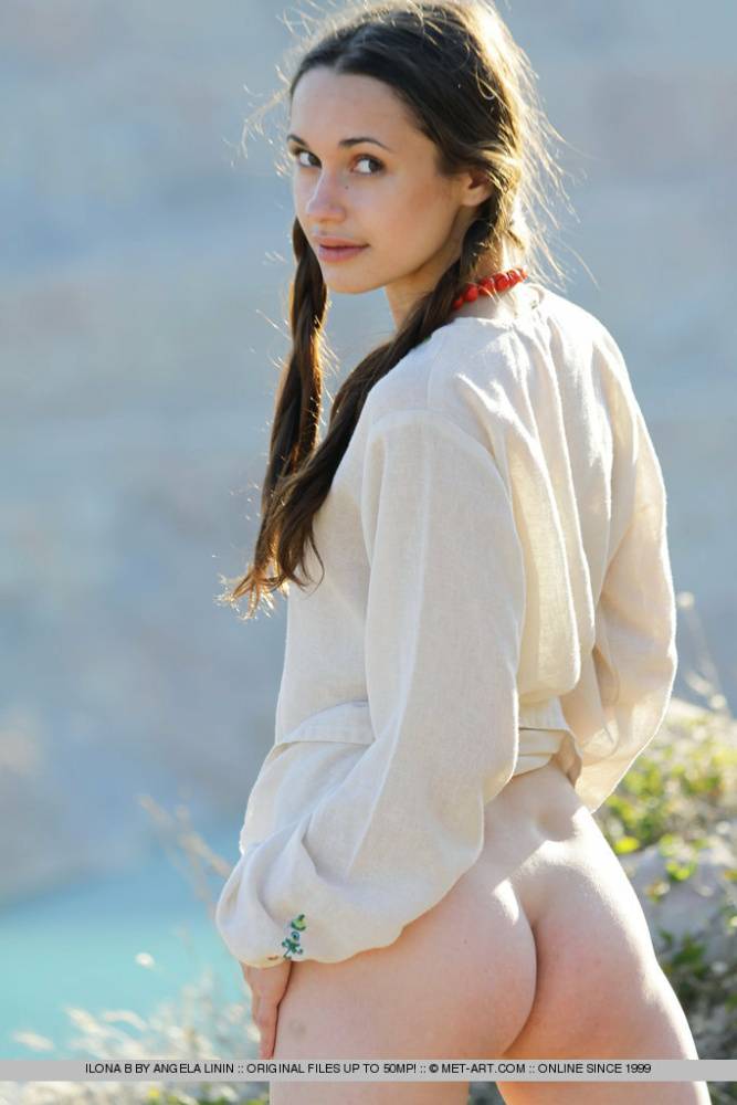 Teen model Ilona B poses nude in pigtails high above ocean waters - #16