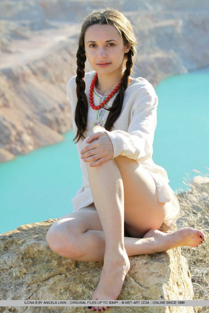 Teen model Ilona B poses nude in pigtails high above ocean waters - #6