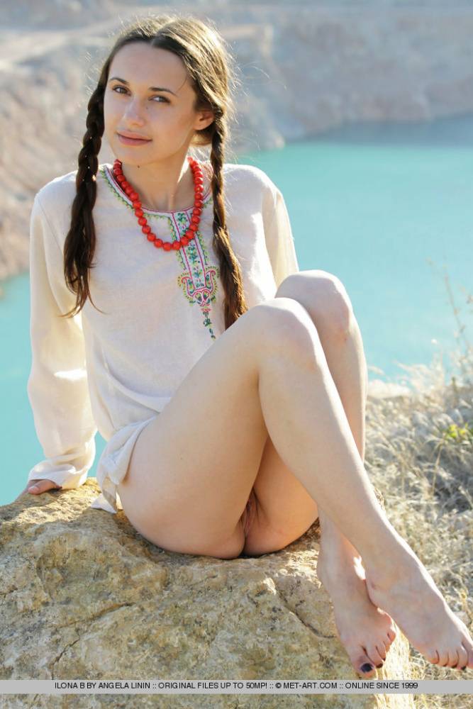 Teen model Ilona B poses nude in pigtails high above ocean waters - #14
