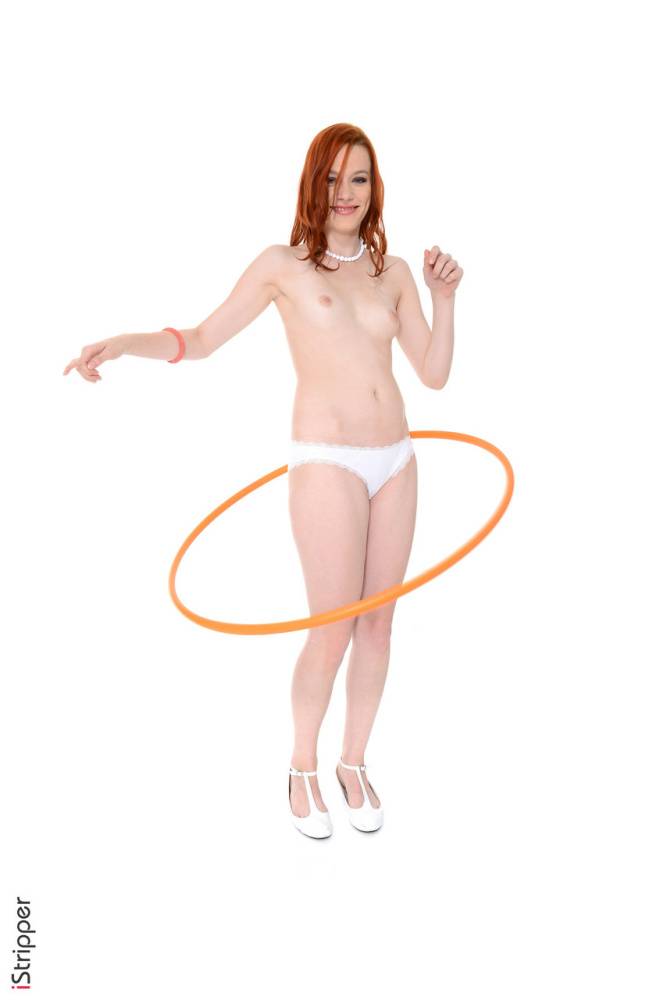 Sexy redhead Amber Cute works a hula hoop while getting naked - #10