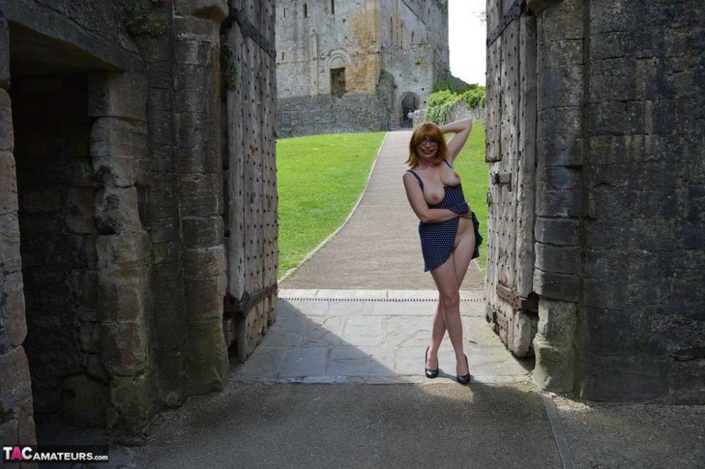 Redheaded amateur Barby Slut gets totally naked while wandering castle grounds - #4