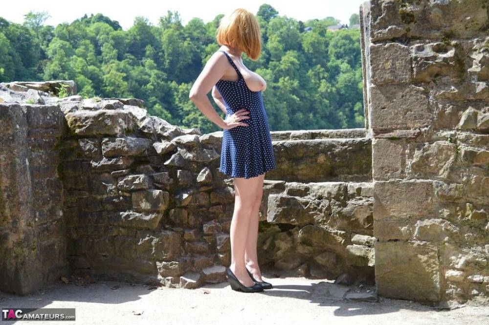 Redheaded amateur Barby Slut gets totally naked while wandering castle grounds - #16