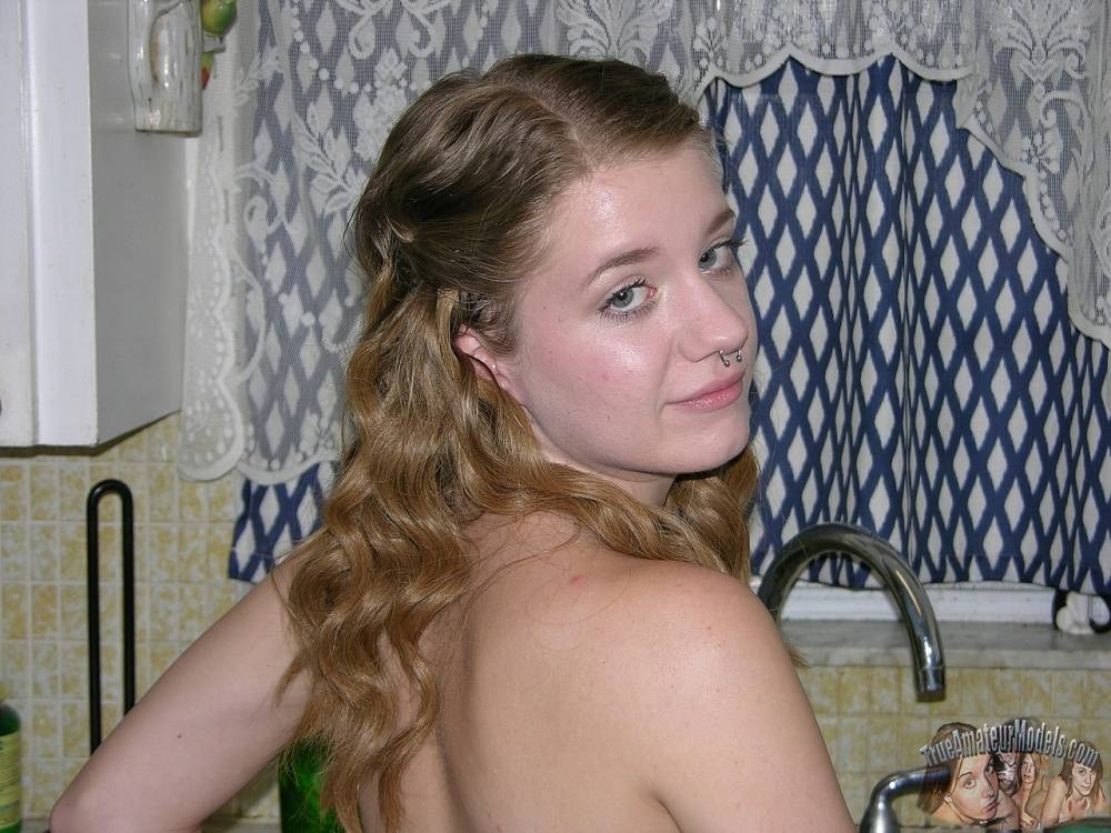 Young looking amateur Dakota B disrobes to go naked around her house - #2