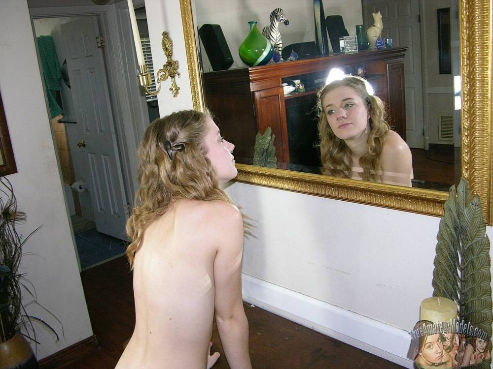 Young looking amateur Dakota B disrobes to go naked around her house - #3