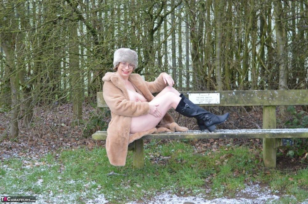 Older amateur Barby Slut exposes herself on snow-covered ground in a park - #8
