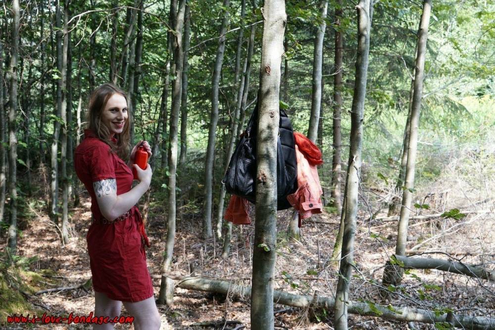 Clothed girl in canvas sneakers finds herself handcuffed to a tree in woods - #14