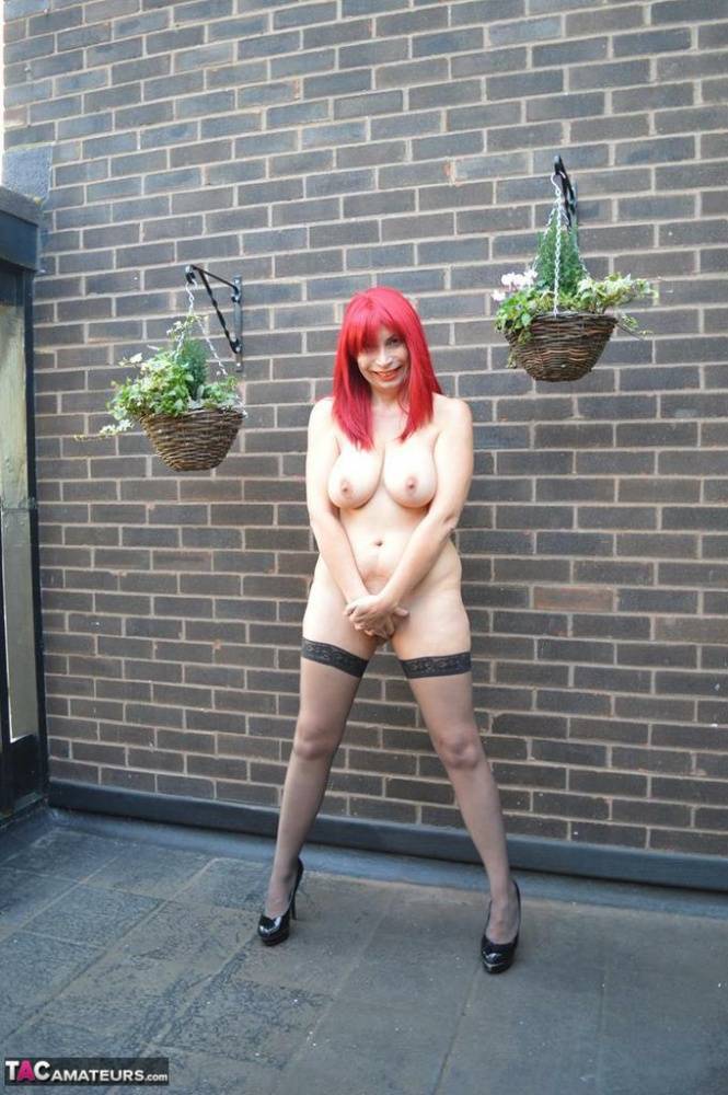 Older redhead Barby Slut exposes herself on the balcony of her condo - #8