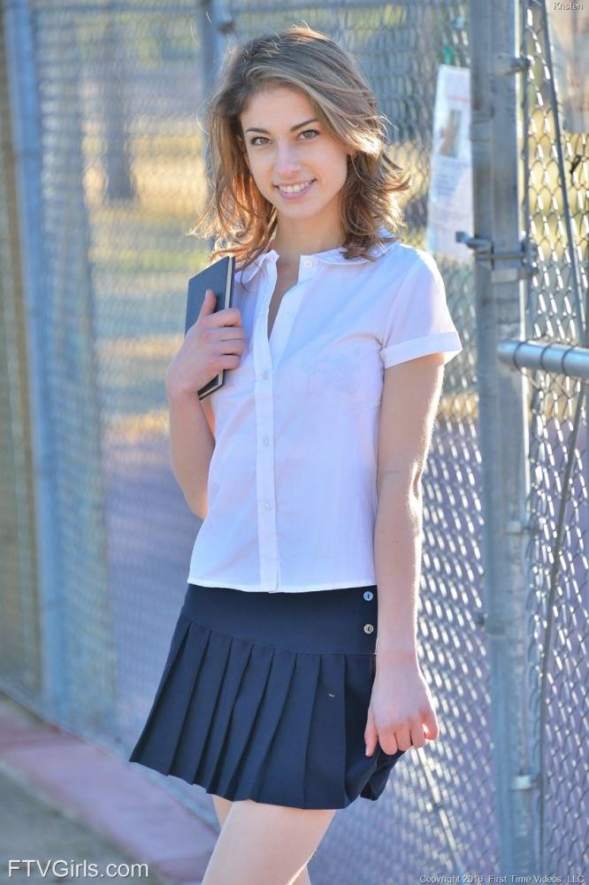 Thin teen shows off her upskirt panties in her schoolgirl uniform on sidewalk - #6