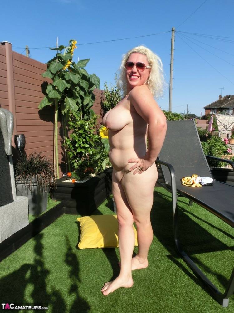 Overweight mature blonde Barby gets naked in a yard before masturbating - #13