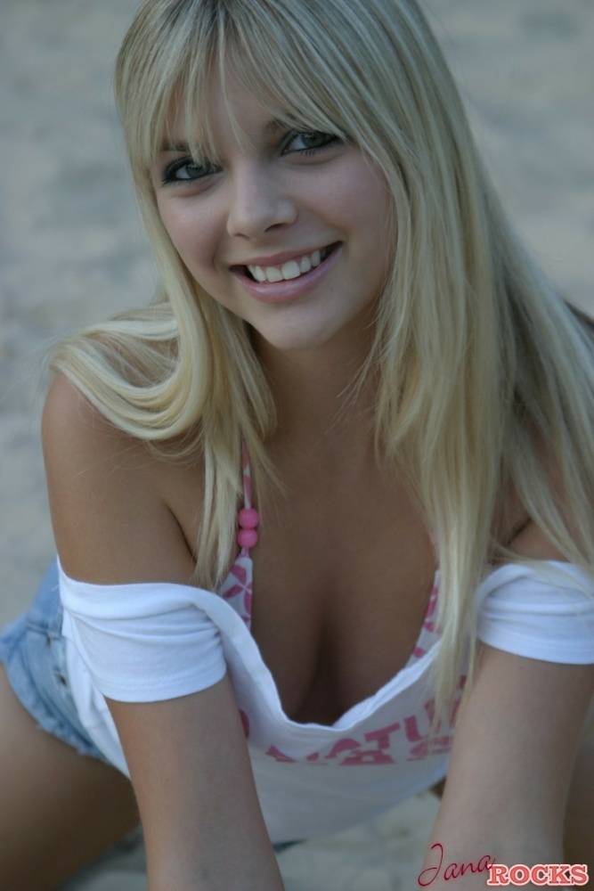 Cute blonde Jana Jordan in a short skirt flashing cleavage at the beach - #2