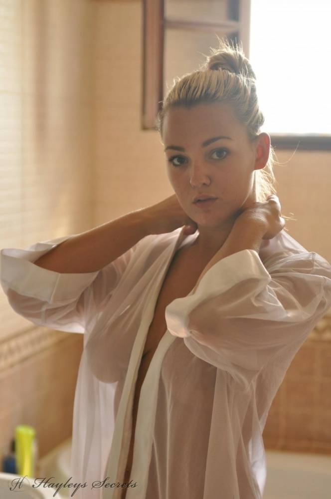 Beautiful blonde chick Jodie Gasson pulls on a see thru blouse in the morning - #4