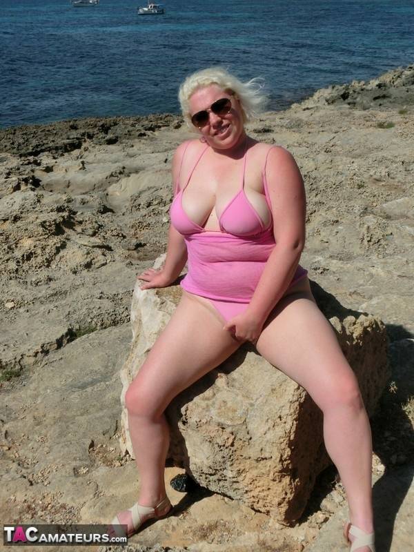 Chubby older blonde Barby gets naked in shades near the ocean - #14