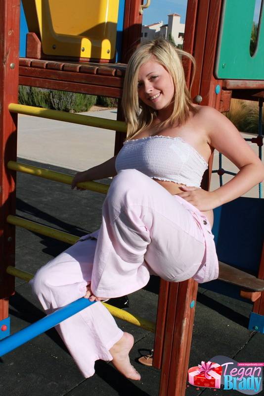Blonde amateur Tegan Brady poses fully clothed on playground equipment - #14