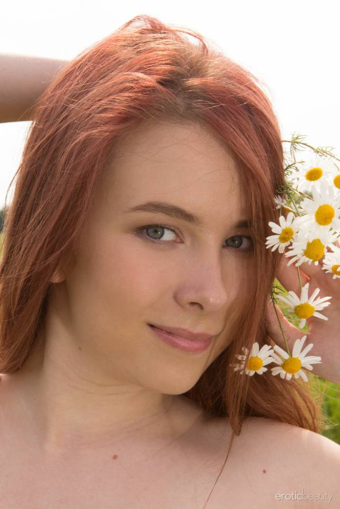 Young redhead Paige gets totally naked in a wide-open field - #3