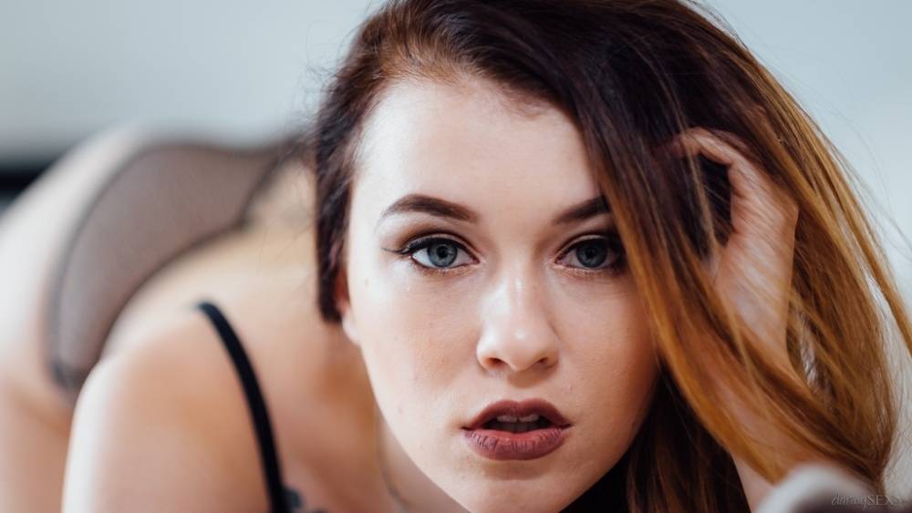 Pale redhead model Misha Cross crosses her legs to display her tight pussy - #9