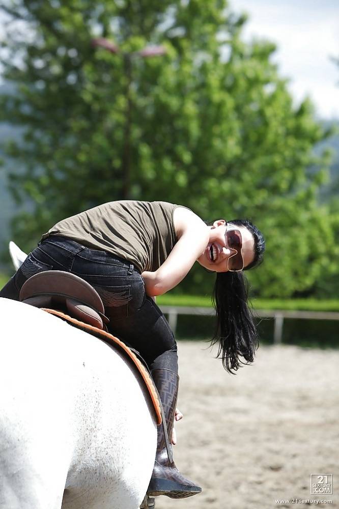 Pornstar Aletta Ocean is riding a horse outdoor in glasses - #16