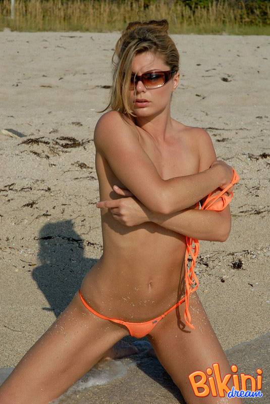 Hot beach beauty Amber in skimpy bikini poses on her knees in the sand - #3