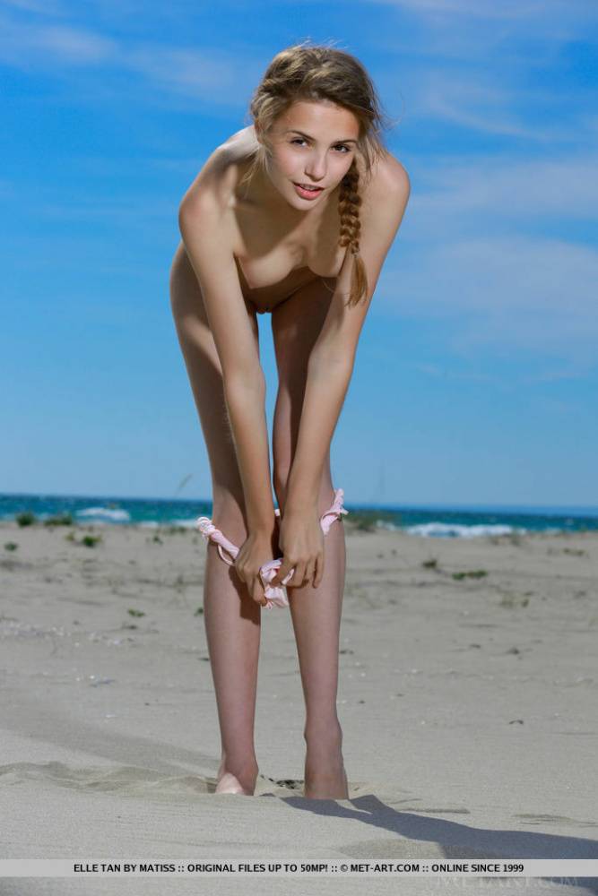 Thin teen girl Elle Tan slips out off her bathing suit to model nude on beach - #1