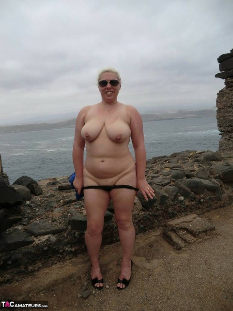 Mature amateur Barby gets totally naked in shades at a coastal location - #1