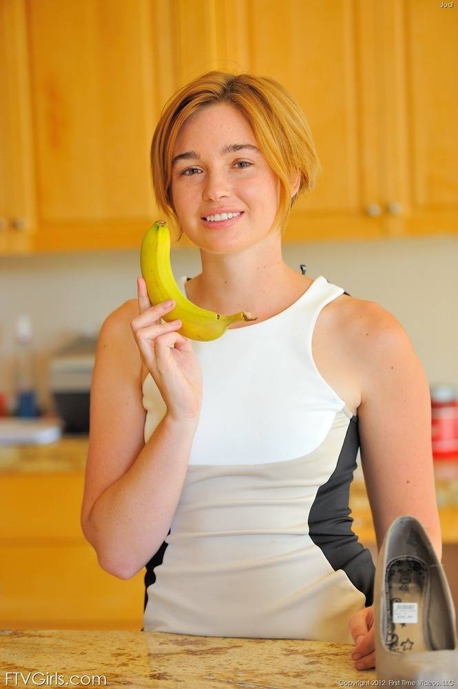 Sensual short-haired looker uses a banana to drill her wet pussy - #2