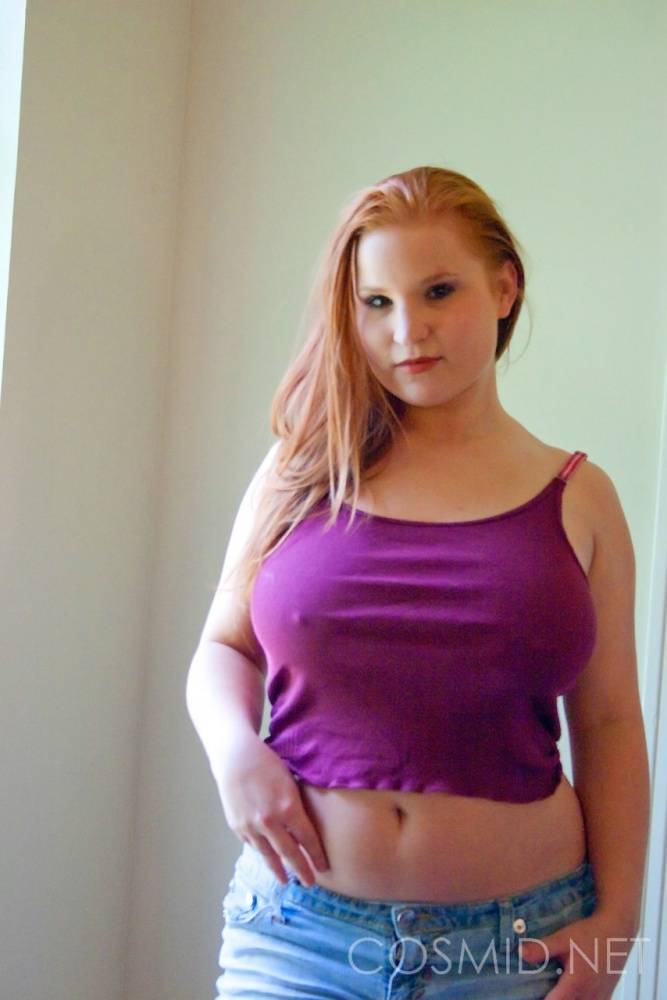 Busty redhead slut Raylinn in the window showing off her massive BBW tits - #7