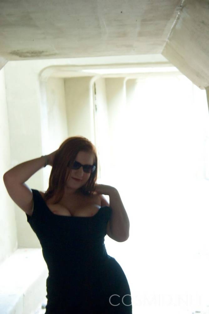 Busty redhead slut Raylinn in the window showing off her massive BBW tits - #6