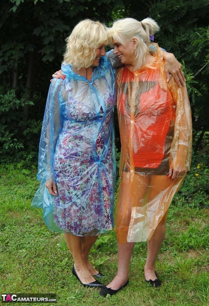 Mature lesbian Dimonty and GF cover their naked bodies in see thru raincoats - #13