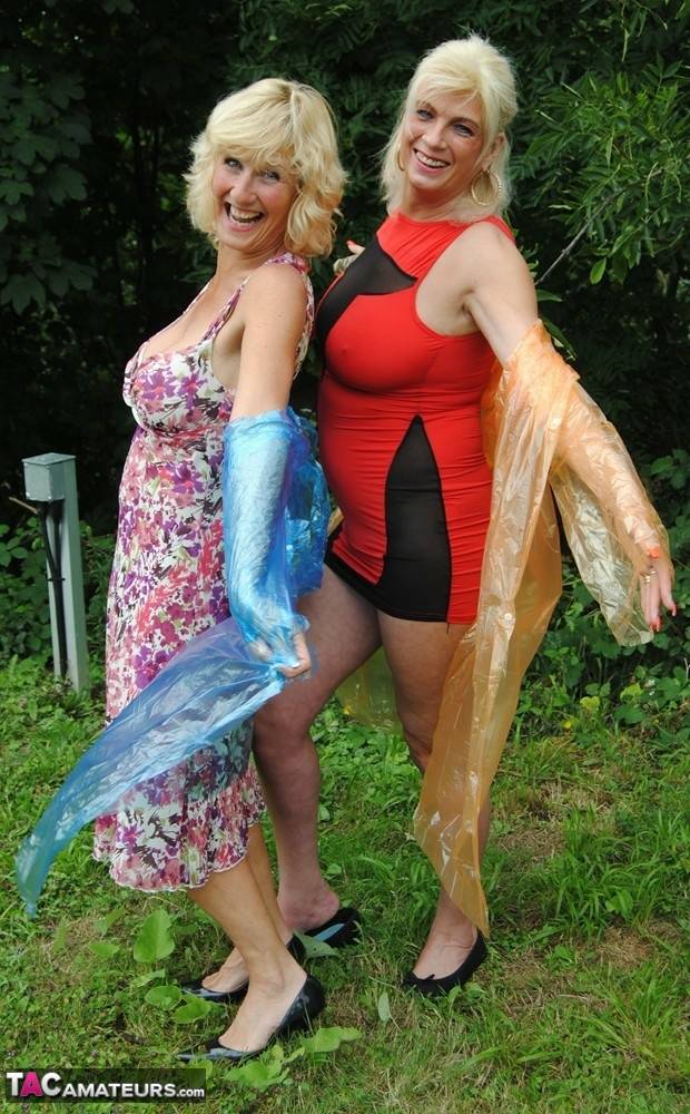 Mature lesbian Dimonty and GF cover their naked bodies in see thru raincoats - #8